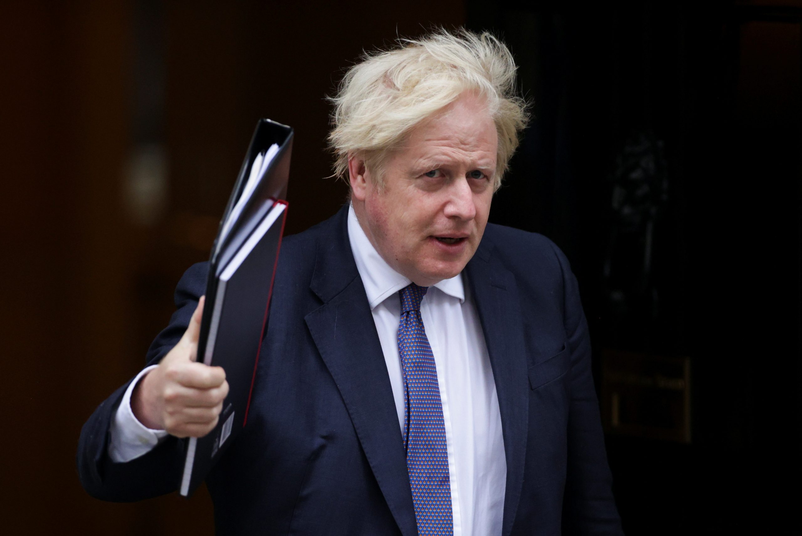 Britain's PM Boris Johnson walks outside Downing Street in London Britain's Prime Minister Boris Johnson walks outside Downing Street in London, Britain, August 18, 2021. REUTERS/Hannah McKay HANNAH MCKAY