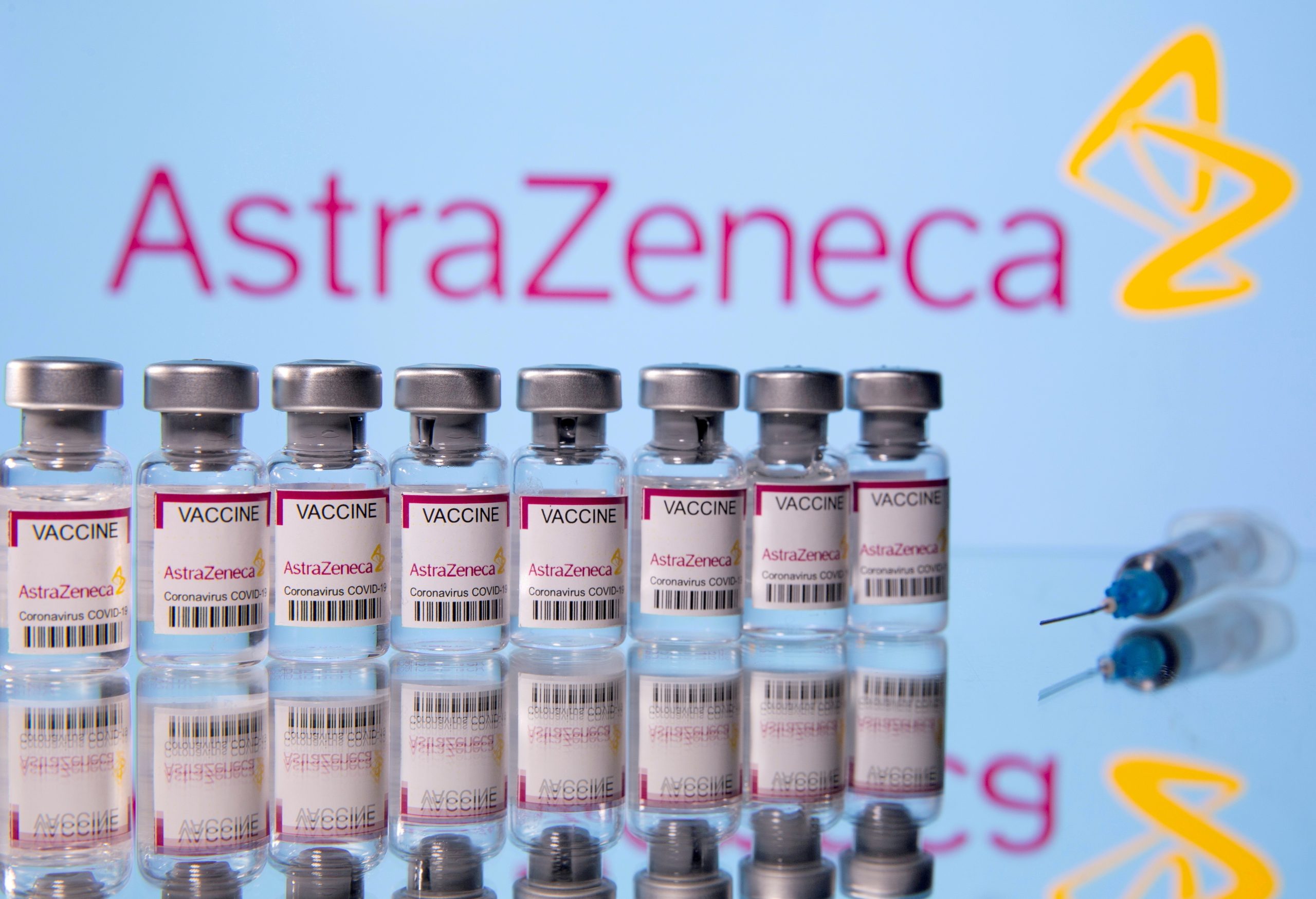 FILE PHOTO: Vials labelled 'Astra Zeneca COVID-19 Coronavirus Vaccine' and a syringe are seen in front of a displayed AstraZeneca logo in this illustration photo FILE PHOTO: Vials labelled "Astra Zeneca COVID-19 Coronavirus Vaccine" and a syringe are seen in front of a displayed AstraZeneca logo, in this illustration photo taken March 14, 2021. REUTERS/Dado Ruvic/Illustration/File Photo Dado Ruvic