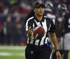 Line judge Maia Chaka tosses a ball during the first half of an NFL preseason between the Tampa Bay Buccaneers and Houston Texans football game Saturday, Aug. 28, 2021, in Houston. (AP Photo/Eric Christian Smith)
