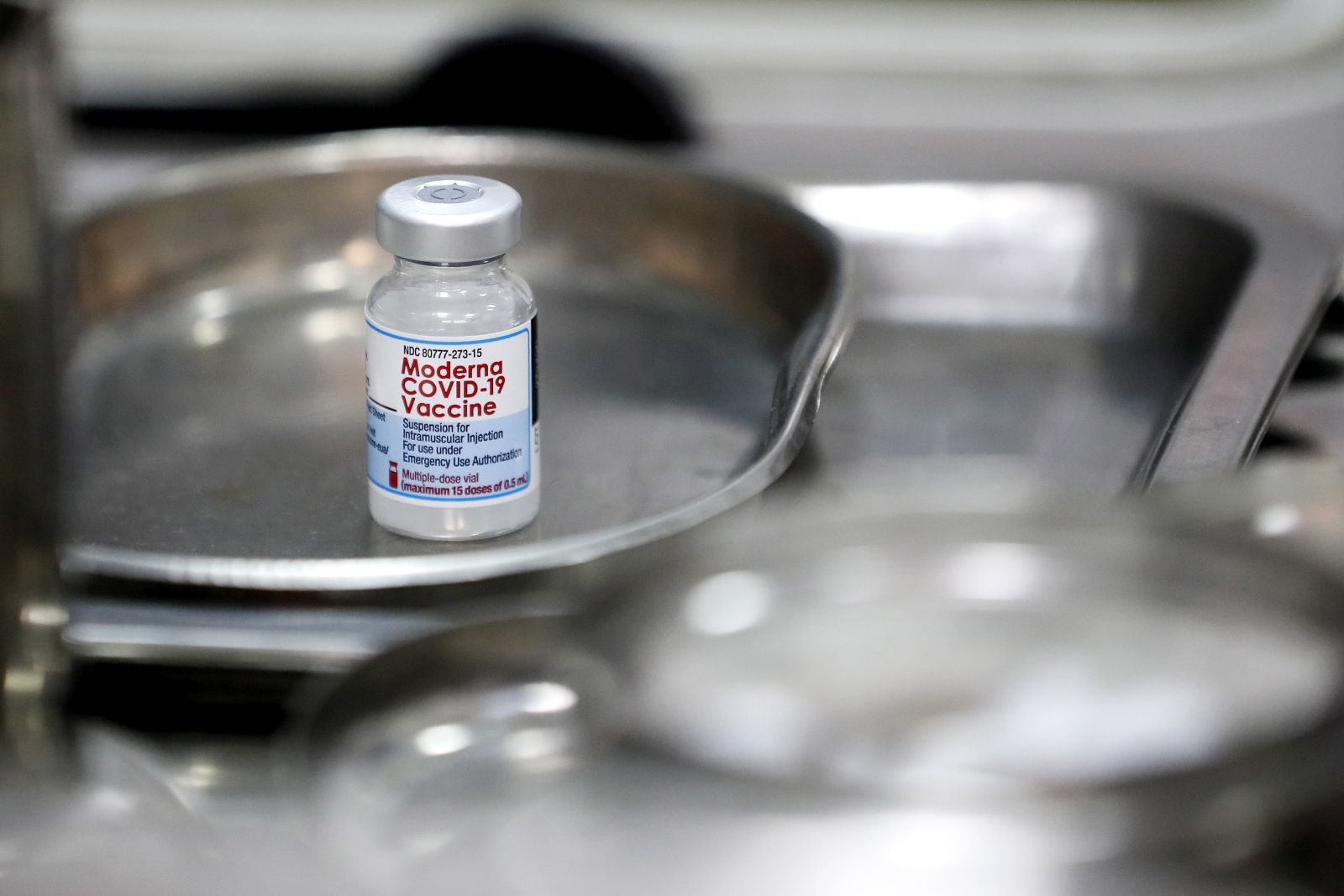epa09429829 (FILE) - A vial of Moderna COVID-19 vaccine sits on a tray, in Hanoi, Vietnam, 27 July 2021 (reissued 26 August 2021). Japan's health ministry suspended the usage of around 1.6 million doses of Moderna COVID-19 vaccine after the discovery of foreign material in a production line.  EPA/LUONG THAI LINH