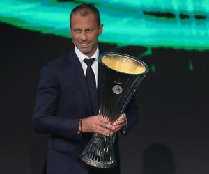 epa09431999 UEFA president Aleksander Ceferin carries the UEFA Europa Conference League trophy the UEFA Draw and Awards Ceremony at the Halic Congress Center in Istanbul, Turkey, 27 August 2021.  EPA/TOLGA BOZOGLU