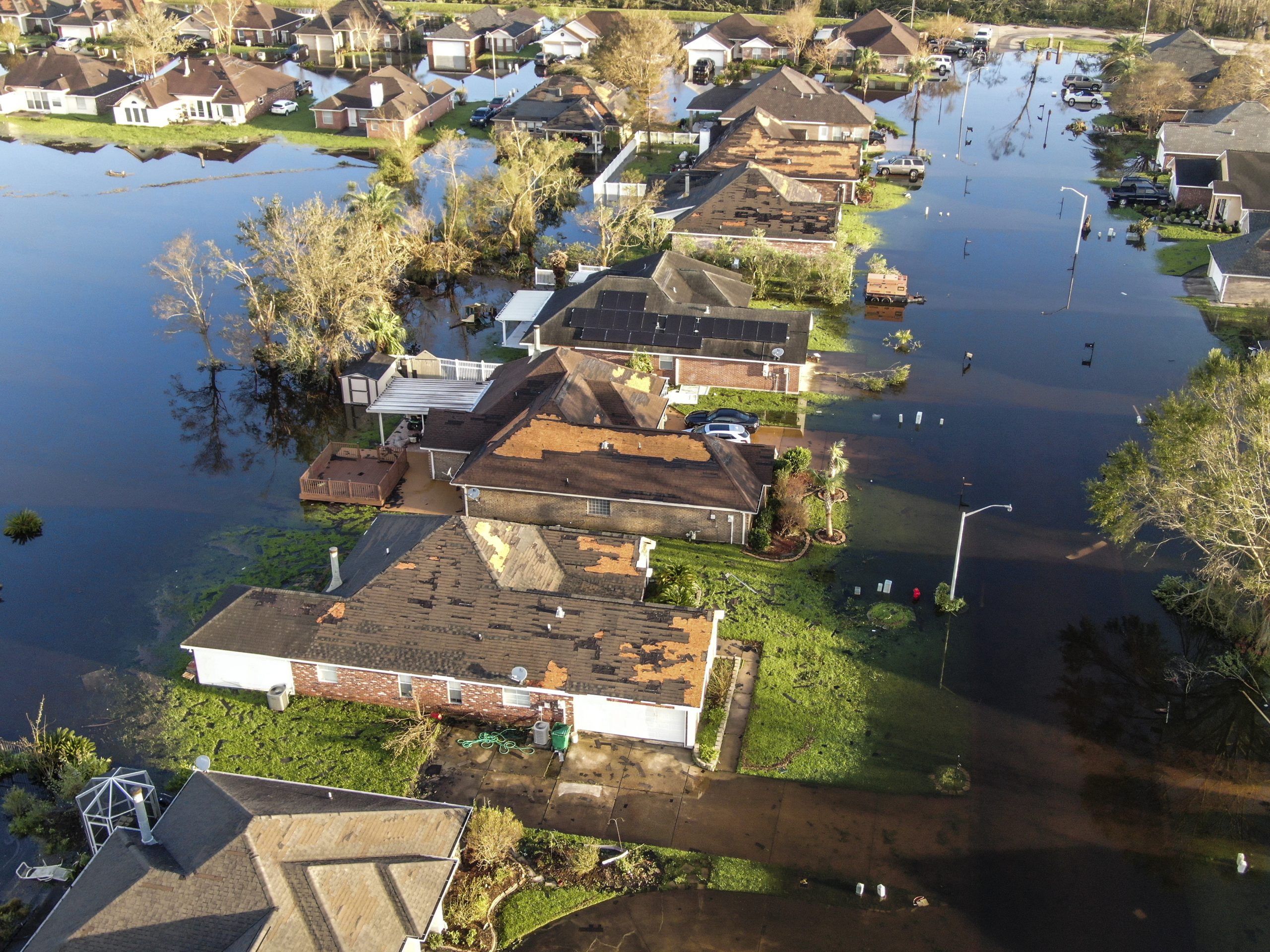 epa09438637 An aerial photo made with a drone shows damage caused by Hurricane Ida in La Place, Louisiana, USA, 01 September 2021. The Category 4 storm came ashore on 29 August causing heavy flooding, downing trees, and ripping off roofs.  EPA/TANNEN MAURY