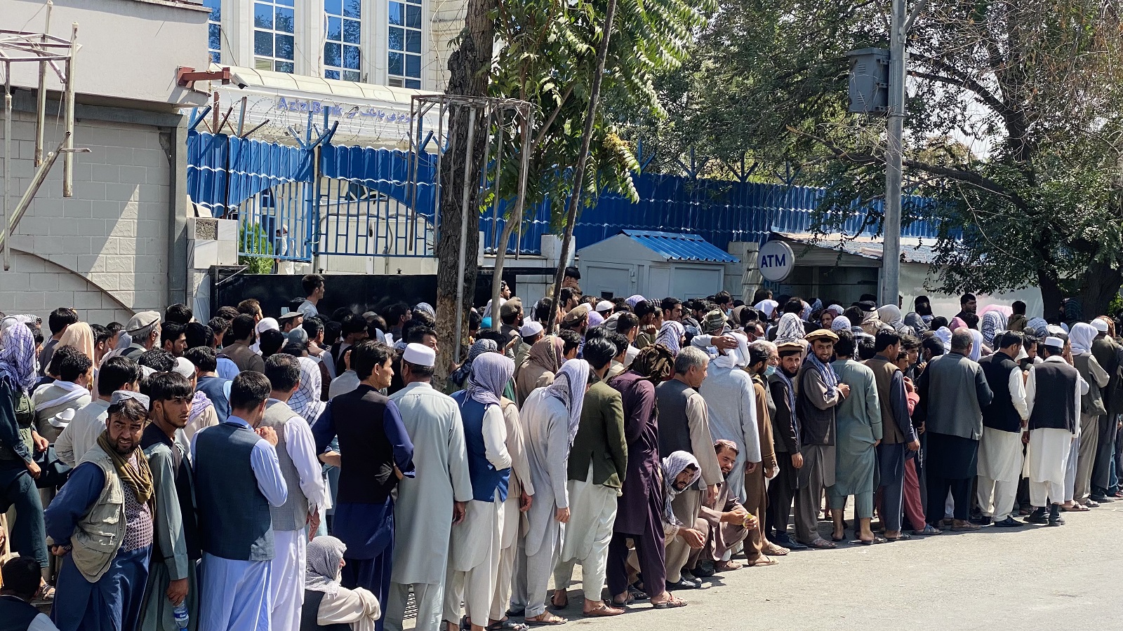 epa09440005 People line up to withdraw money from banks as banks allowed only $200 withdrawal per week from an account at their central branches in Kabul, Afgahnistan, 01 September 2021. The Taliban called for support from the international community to revive an economy battered by two decades of conflict and heavily dependent on foreign aid. Chief Taliban spokesman Zabihullah Mujahid said one of the main objectives after the Taliban's "victory" is the reconstruction of the country and assured that the international community must trust that the aid to Afghanistan under the Taliban will be directed through “proper channels”.  EPA/STRINGER