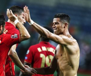 epa09441734 Cristiano Ronaldo (R) of Portugal celebrates after scoring a goal during the FIFA World Cup Qatar 2022 group A qualification soccer match between Portugal and Ireland held at Algarve stadium in Faro, Portugal, 01 September  2021.  EPA/ANTONIO COTRIM