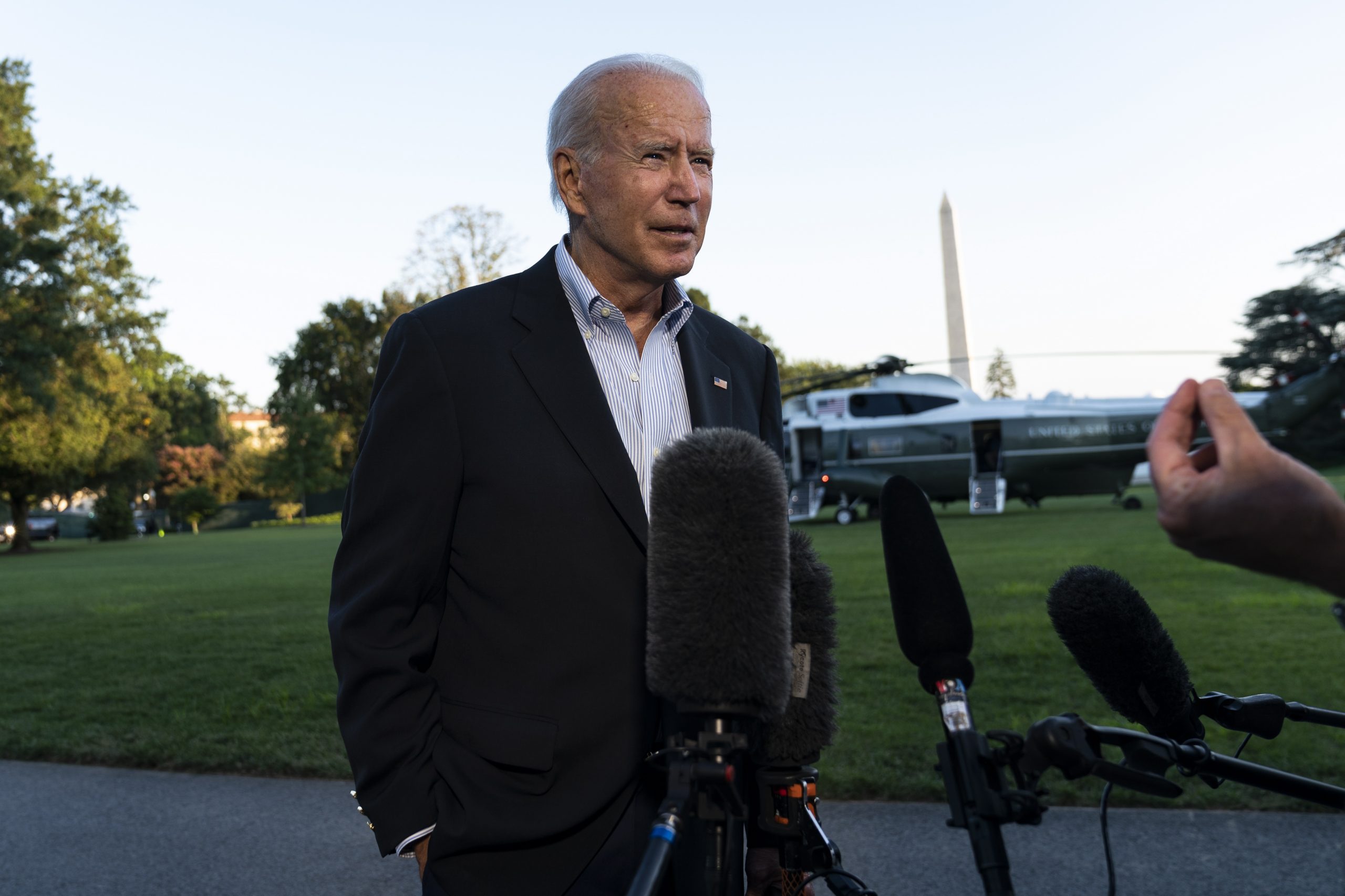 epa09454304 US President Joe Biden speaks with reporters after arriving at the White House via Marine One, in Washington, DC, USA, 07 September 2021. Biden traveled to New Jersey and New York to tour areas effected by Hurricane Ida and met with local leaders.  EPA/Alex Edelman / POOL