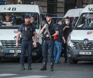 epa09455039 French police officers secure the Courthouse before the arrival of the convoy transporting Salah Abdeslam and other members of the commando accused of being involved in the 2015 Paris attacks, outside the Paris courthouse, in Paris, France, 08 September 2021. The trial over the 13 November 2015 terrorist attacks is set to begin on 08 September and will last nine months. 130 people were killed and hundreds were injured in a series of coordinated attacks targeting the Bataclan concert hall, the Stade de France national sports stadium, and several restaurants and bars.  EPA/CHRISTOPHE PETIT TESSON