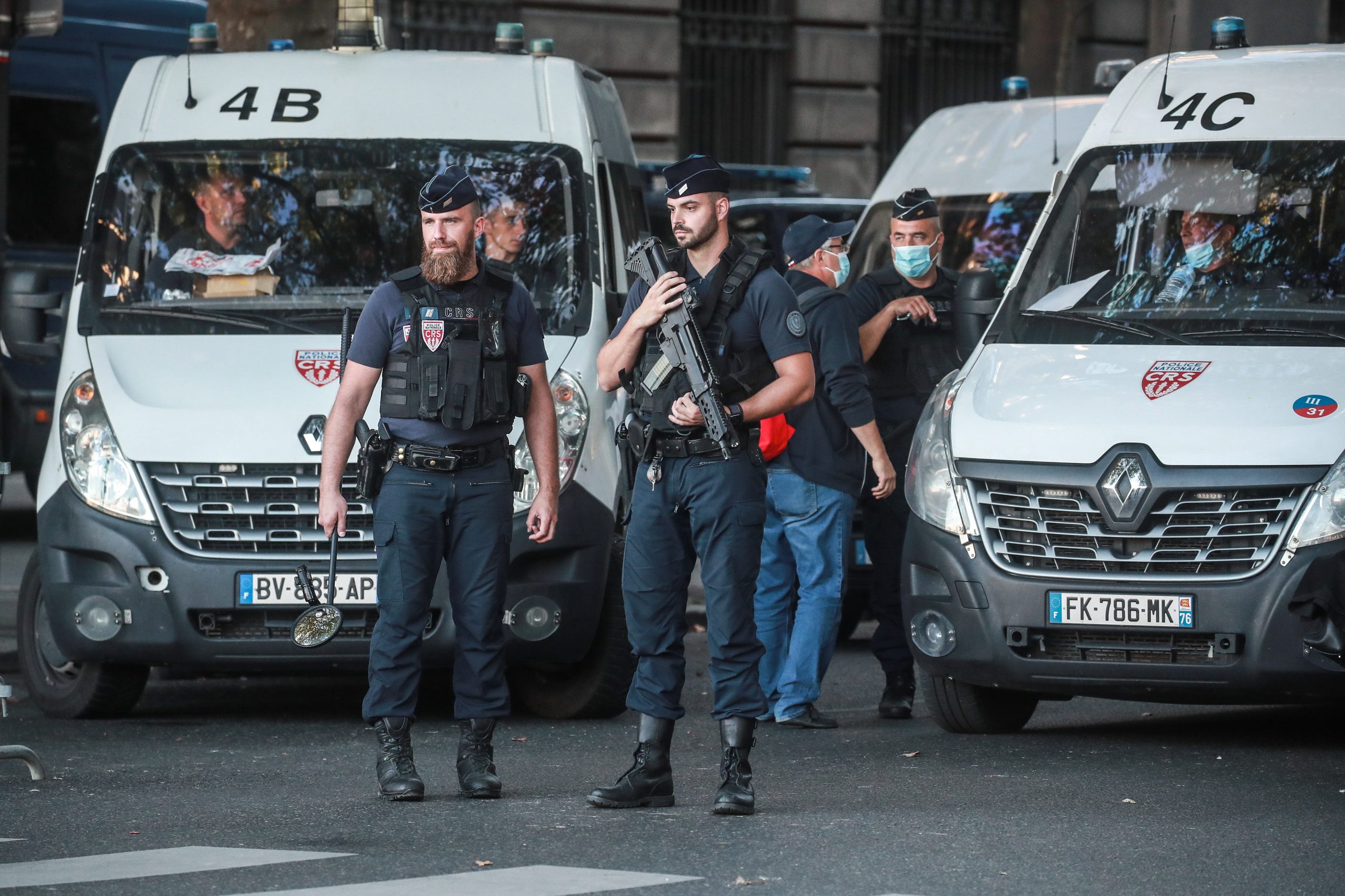epa09455039 French police officers secure the Courthouse before the arrival of the convoy transporting Salah Abdeslam and other members of the commando accused of being involved in the 2015 Paris attacks, outside the Paris courthouse, in Paris, France, 08 September 2021. The trial over the 13 November 2015 terrorist attacks is set to begin on 08 September and will last nine months. 130 people were killed and hundreds were injured in a series of coordinated attacks targeting the Bataclan concert hall, the Stade de France national sports stadium, and several restaurants and bars.  EPA/CHRISTOPHE PETIT TESSON