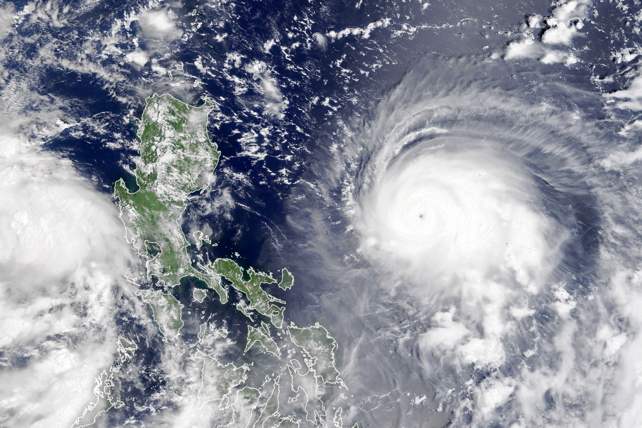 epa09459010 A handout satellite imaget made available by the National Aeronautics and Space Administration (NASA) of typhoon Chanthu as it churned the Philippine Sea, 09 September 2021 (issued 10 September 2021). On 09 September, by 11 p.m. Philippine Standard Time (1500 Universal Time), the typhoon was about 550 km east-northeast of Manila, with sustained winds of 220 kph. The typhoon, named 'Kiko' in the Philippines, is predicted to pass just north of the island of Luzon as a category 4 storm. It is likely to arrive at Taiwan on 11 or 12.  EPA/NASA HANDOUT  HANDOUT EDITORIAL USE ONLY/NO SALES