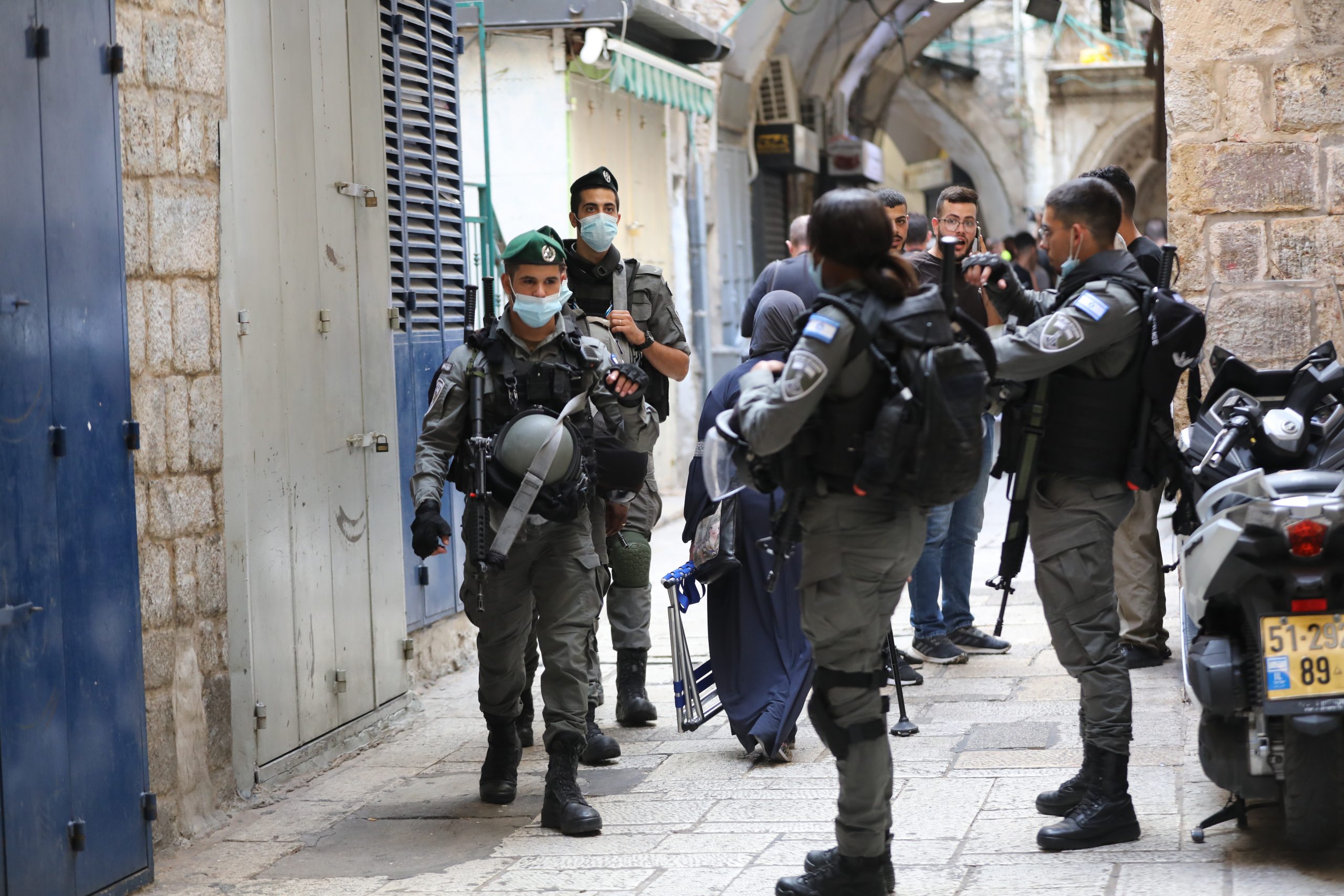 epa09459812 Israeli border police stand guard at the site where a stabbing attack took place in the Old City of Jerusalem, 10 September 2021. A Palestinian man attempted to stab Israeli Police officers but was, according to Israeli police.  EPA/ABIR SULTAN