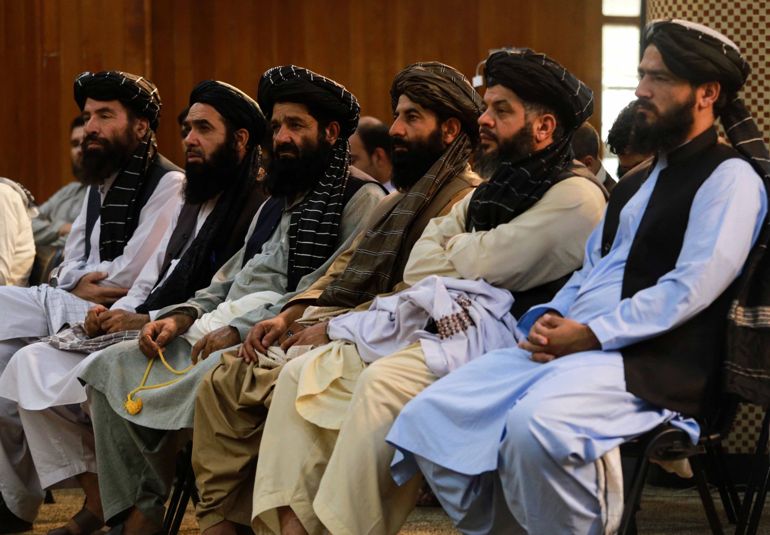 epa09463061 Taliban listen to Sheikh Abdul Baqi Haqqani, Taliban's Acting Minister of Higher Education, during a ceremony in Kabul, Afghanistan, 12 September 2021. Citing the threat of a humanitarian catastrophe, the  United Nations made an appeal to the international community to unblock aid to Afghanistan that was frozen when the Taliban returned to power nearly 20 years after being ousted by the United States. Afghans who plan to flee the country or are in need of cash to buy groceries and food resort to sell their household items as country's economy is in shambles due to uncertainty.  EPA/STRINGER