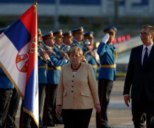 epa09465835 Serbian President Aleksandar Vucic (R) and German Chancellor Angela Merkel (L) inspect the guard of honour during the welcoming ceremony in Belgrade, Serbia, 13 September 2021. Chancellor Merkel is on an official state visit to Serbia.  EPA/ANDREJ CUKIC