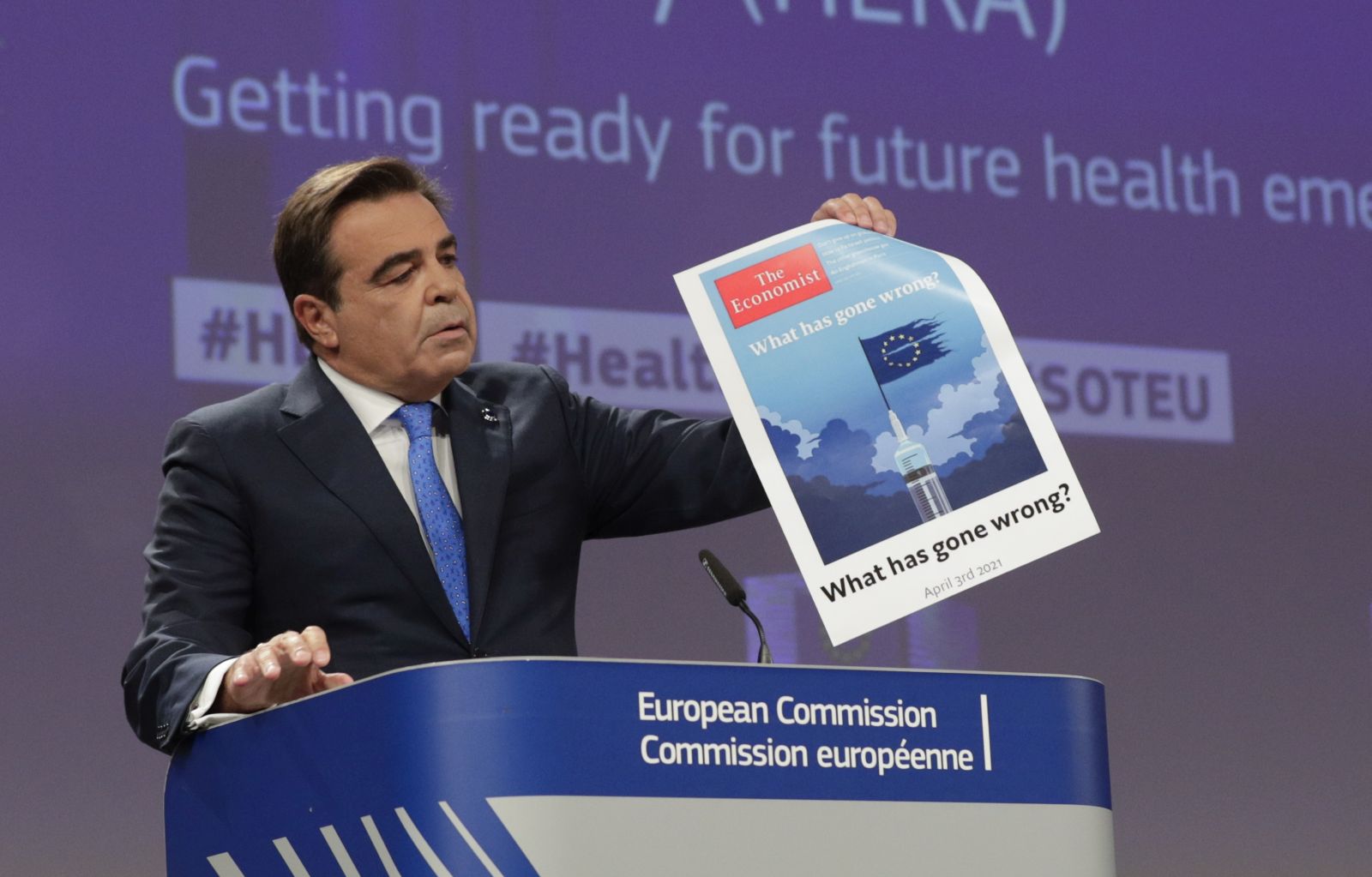 epa09471274 European Commission Vice-President for Promoting our European Way of Life, Margaritis Schinas (L) shows the front page of an issue of The Economist asking the EU 'What has gone wrong' next to European Health Commissioner Stella Kyriakides (R) during a press conference to present the European Health Emergency Preparedness and Response Authority (HERA) in Brussels, Belgium, 16 September 2021.  EPA/OLIVIER HOSLET