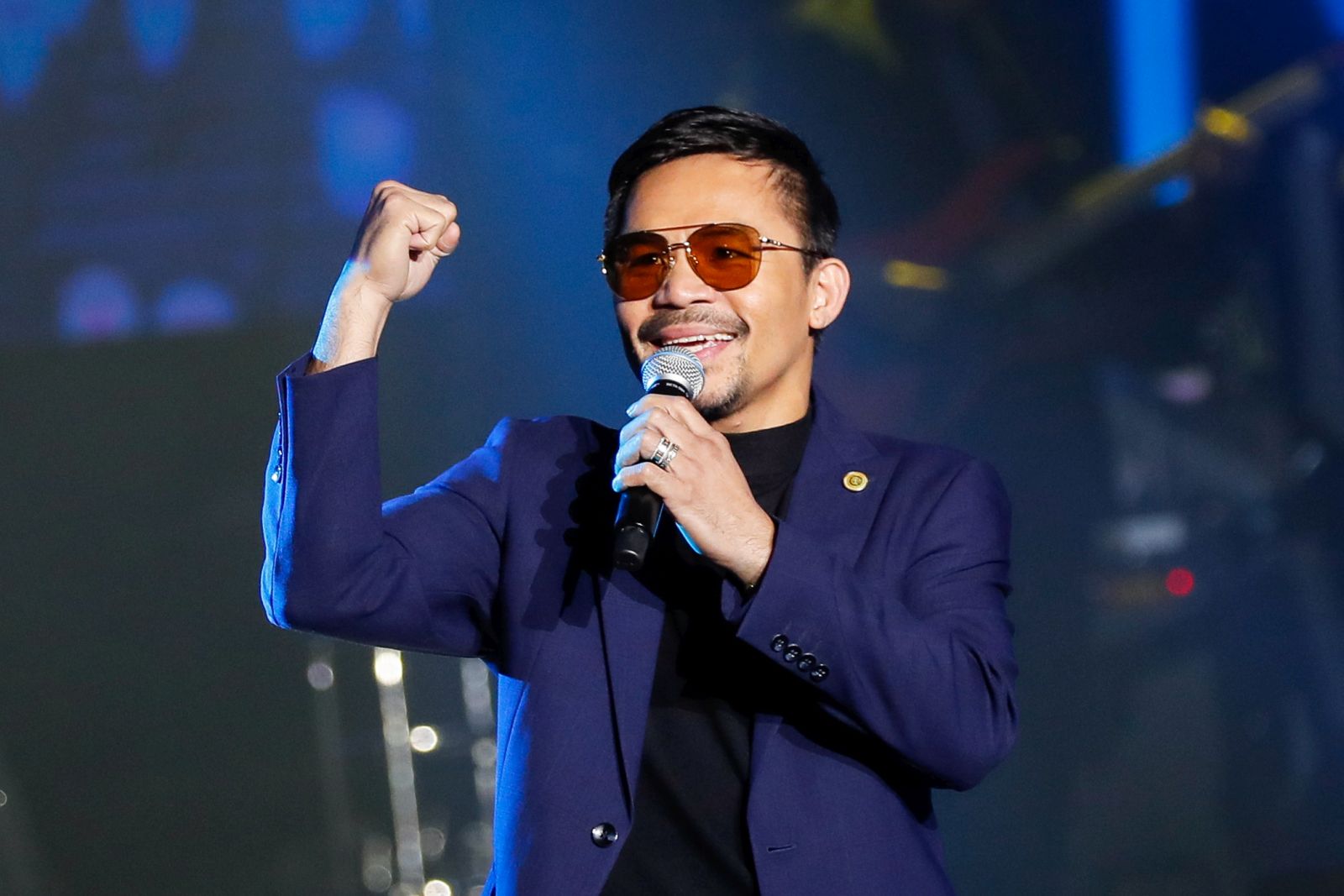 epa09475975 (FILE) - Filipino boxing champion and senator Manny Pacquiao performs during the launch of his own crypto currency in Manila, Philippines 01 September 2019 (reissued 19 September 2021). Pacquiao accepted the nomination of his PDP-Laban party to run for president in 2022, as he said on 19 September 2021.  EPA/MARK R. CRISTINO *** Local Caption *** 55435064