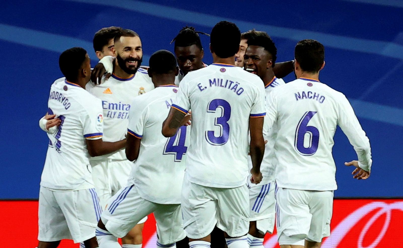 epa09482356 Real Madrid's striker Karim Benzema (2-L) celebrates with teammates after scoring the 1-0 goal during the Spanish LaLiga soccer match between Real Madrid and RCD Mallorca held at Santiago Bernabeu stadium in Madrid, central Spain, 22 September 2021.  EPA/Juanjo Martin