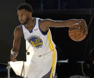 Golden State Warriors forward Andrew Wiggins poses for photos during the NBA basketball team's media day in San Francisco, Monday, Sept. 27, 2021. (AP Photo/Jeff Chiu)