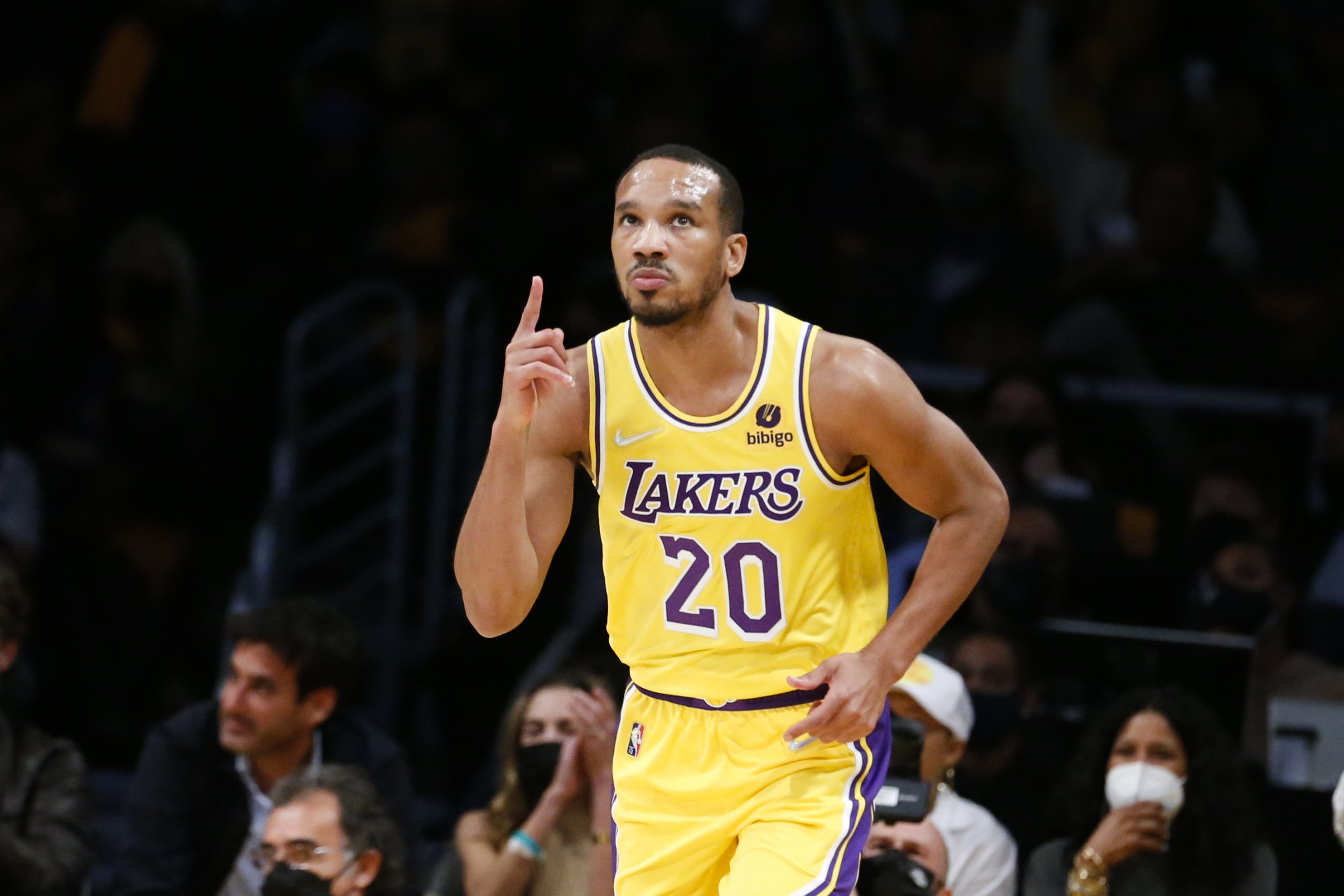 Los Angeles Lakers guard Avery Bradley (20) gestures after scoring a 3-pointer against the Golden State Warriors during the second half of an NBA basketball game in Los Angeles, Tuesday, Oct. 19, 2021. The Warriors won 121-114. (AP Photo/Ringo H.W. Chiu)