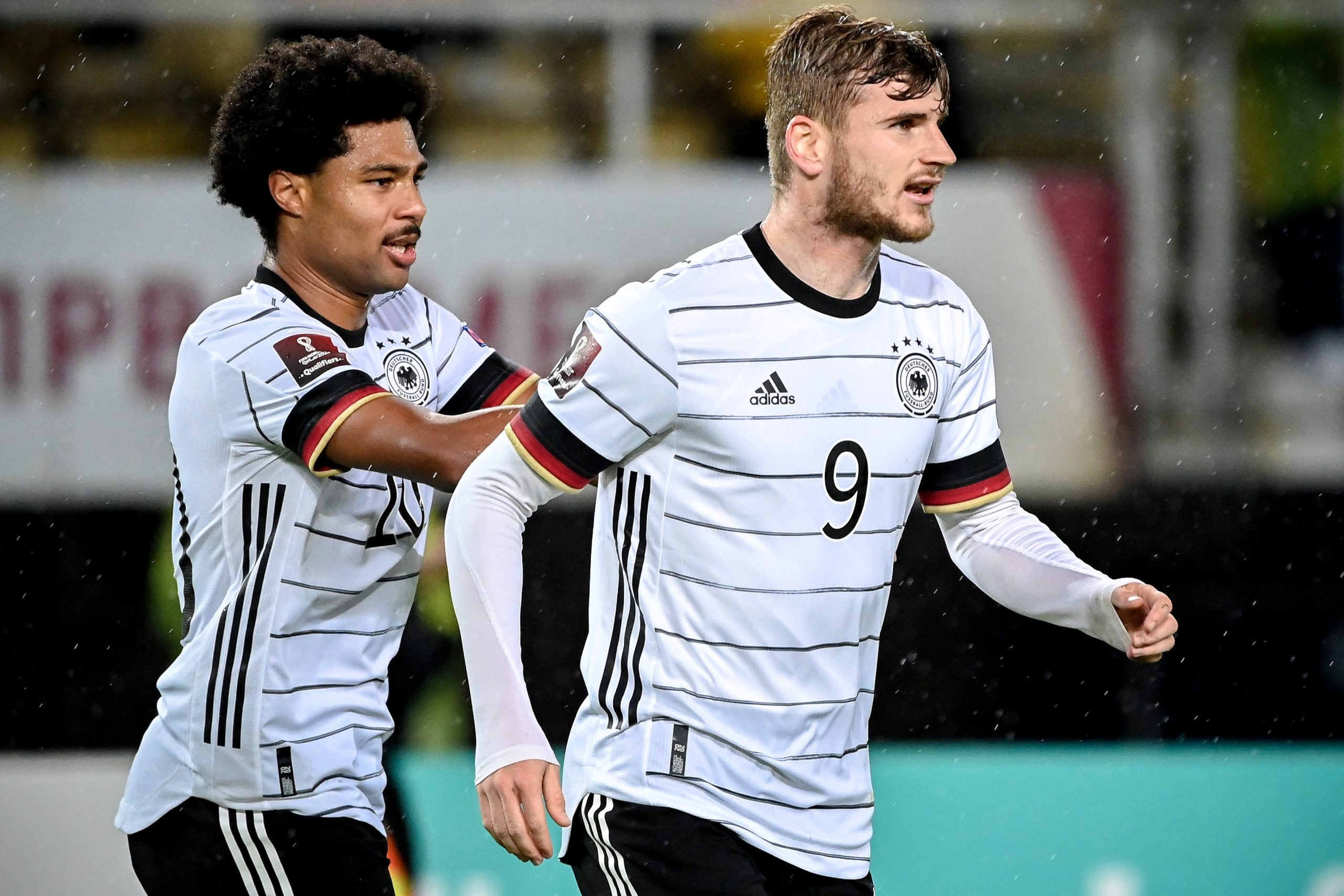 epa09519246 Germany's Timo Werner (R) celebrates with his teammate Serge Gnabry (L) after scoring the 3-0 lead during the FIFA World Cup Qatar 2022 qualifying Group J soccer match between North Macedonia and Germany in Skopje, Republic of North Macedonia, 11 October 2021.  EPA/GEORGI LICOVSKI