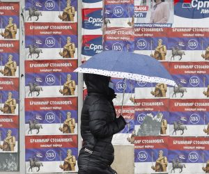 epa09525979 A woman walks in front of the electoral posters in Gracanica, Kosovo, 15 October 2021. Citizens of Kosovo will vote on their local elections on 17 October 2021.  EPA/VALDRIN XHEMAJ