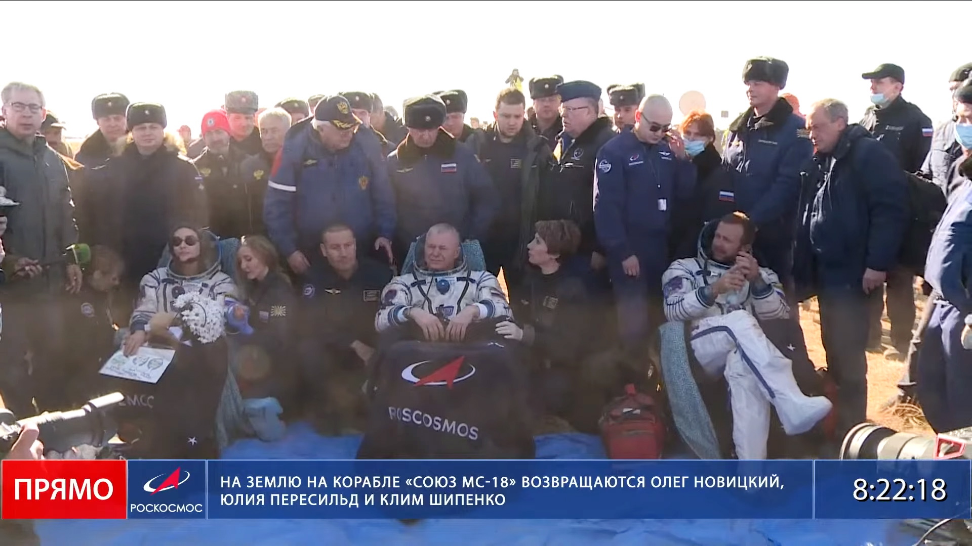 epa09528130 A handout photo taken from video footage made available by Roscosmos press service shows (L-R) Russian actress Yulia Peresild, cosmonaut Oleg Novitsky and film director Klim Shipenko after the landing of the Russian Soyuz MS-18 space capsule in a remote area southeast of Zhezkazgan in the Karaganda region of Kazakhstan, 17 October 2021. A Soyuz space capsule with Russian crew member, cosmonaut Oleg Novitsky, actress Yulia Peresild and film director Klim Shipenko, returning from a twelve day mission to make the first a feature film in orbit at the International Space Station, landed safely in the steppes of Kazakhstan.  EPA/ROSCOSMOS PRESS SERVICE / HANDOU  HANDOUT EDITORIAL USE ONLY/NO SALES