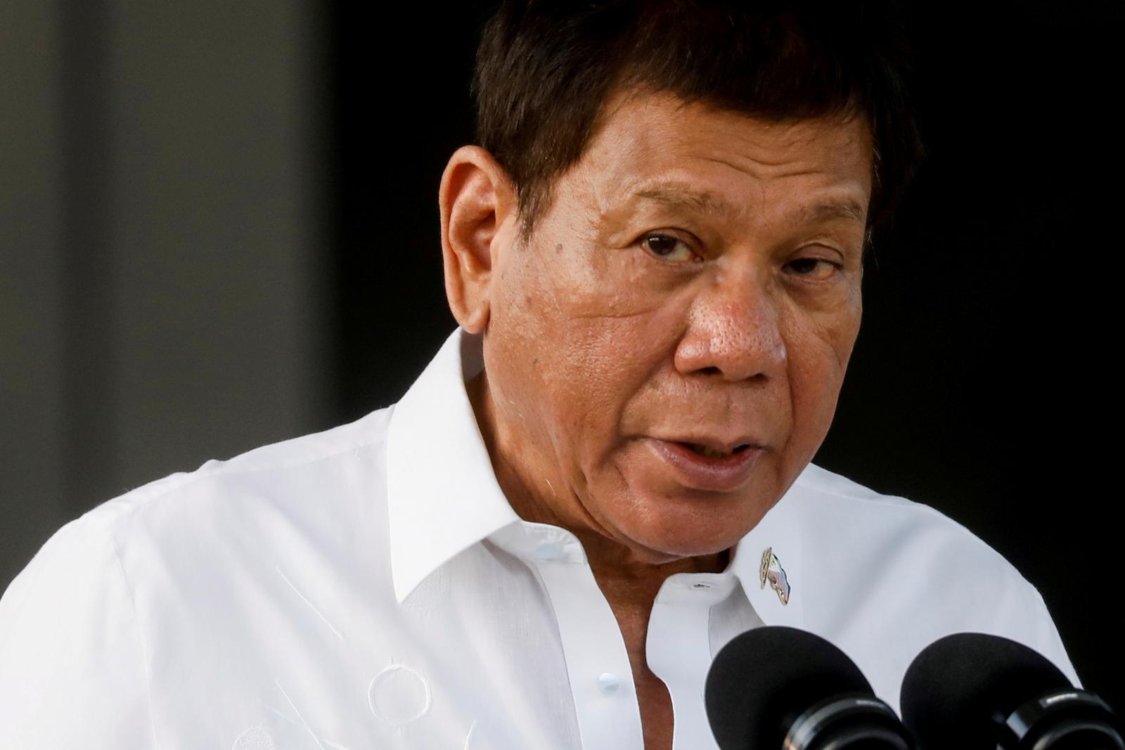 FILE PHOTO: Philippine President Rodrigo Duterte speaks during the arrival ceremony for the first COVID-19 vaccines to arrive in the country, at Villamor Air Base in Pasay, Metro Manila, Philippines, February 28, 2021. REUTERS/Eloisa Lopez/File Photo