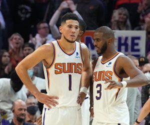 Phoenix Suns guard Devin Booker (1) and guard Chris Paul (3) during the second half of an NBA basketball game against the Sacramento Kings, Wednesday, Oct. 27, 2021, in Phoenix. (AP Photo/Rick Scuteri)