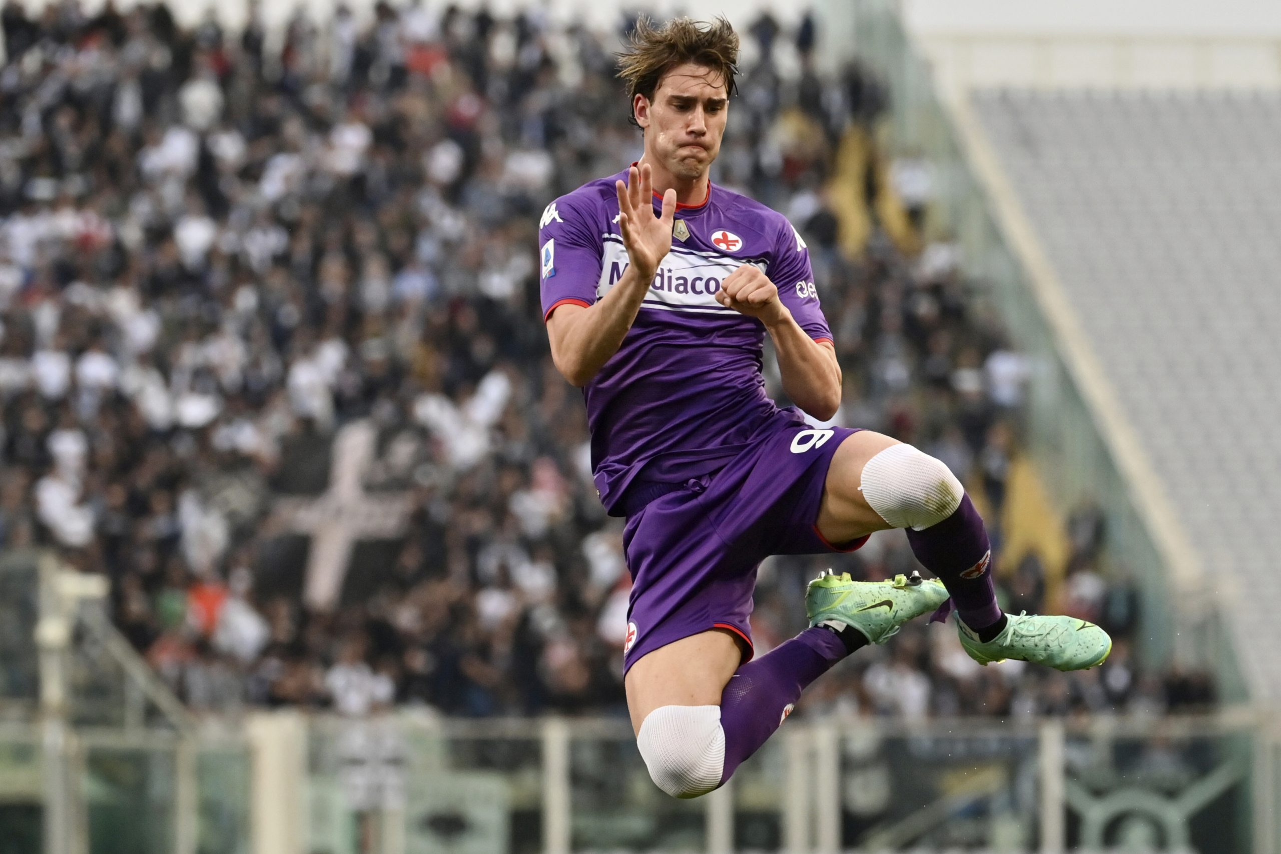 Fiorentina's Dusan Vlahovic celebrates after scoring during the Serie A soccer match between Fiorentina and Spezia, at the Artemio Franchi stadium in Florence, Italy, Sunday, Oct. 31, 2021. (Massimo Paolone/LaPresse via AP)