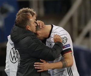 epa09519265 Germany's head coach Hansi Flick (L) reacts with his player Niklas Suele (R) after the FIFA World Cup 2022 qualifying soccer match between North Macedonia and Germany in Skopje, Republic of North Macedonia 11 October 2021.  EPA/VALDRIN XHEMAJ