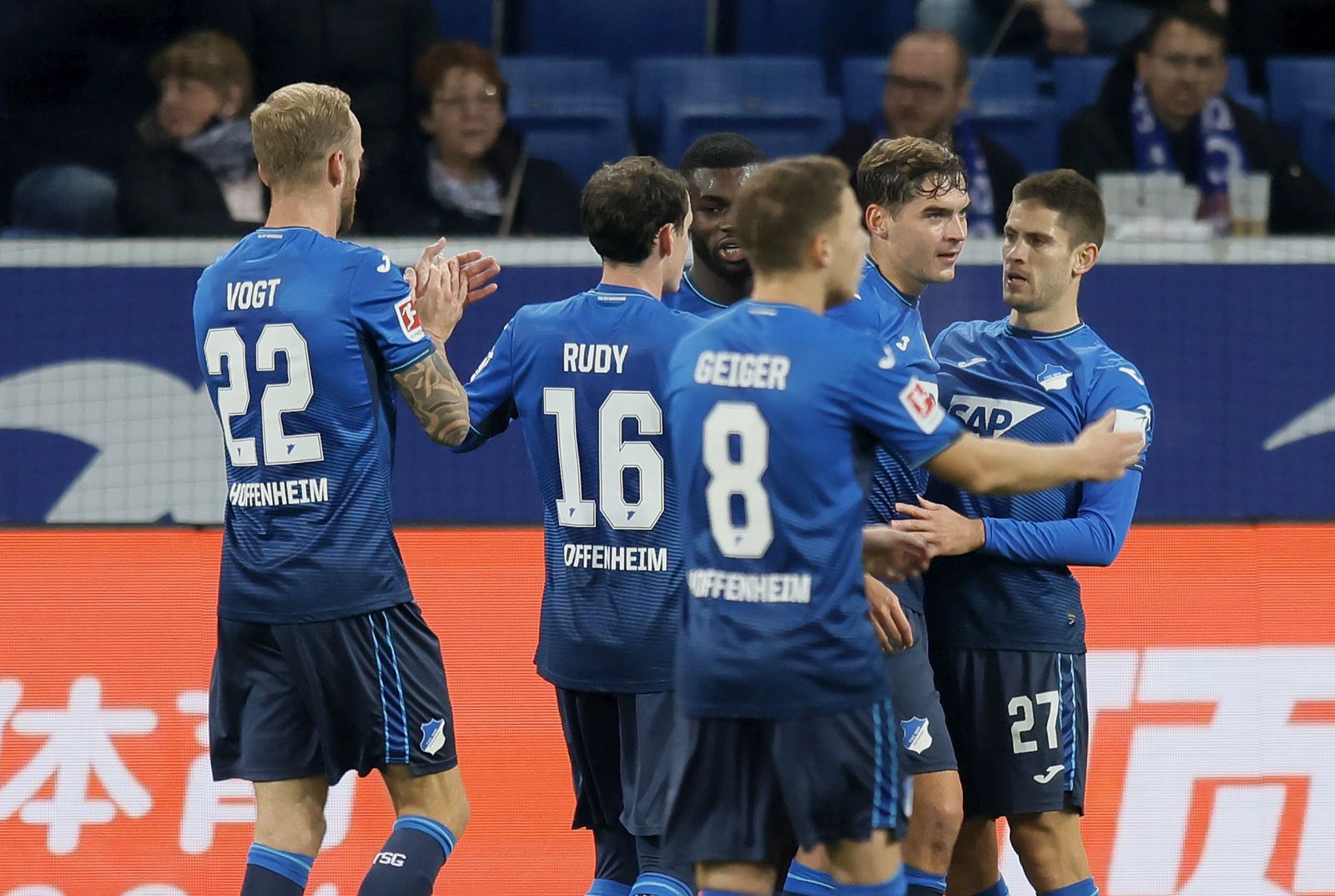 epa09552827 Hoffenheim's Andrej Kramaric (R) celebrates with teammates after scoring the opening goal during the German Bundesliga soccer match between TSG 1899 Hoffenheim and Hertha BSC Berlin in Sinsheim, Germany, 29 October 2021.  EPA/RONALD WITTEK CONDITIONS - ATTENTION: The DFL regulations prohibit any use of photographs as image sequences and/or quasi-video.