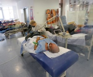epa09563774 Romanian infected patients are sitting in their beds while receiving oxygen and medical care at a makeshift emergency room that was installed in the waiting hall of Bucharest Emergency University Hospital, in Bucharest, Romania, 04 November 2021. Romania registered today 489 coronavirus related deaths, 1,902 patients being hospitalized in intensive care units, in the entire country. Romanian health authorities are struggling to cope with the outbreak of the fourth wave, as only 37percent of the adult population has been immunized trough vaccination. Bucharest University Hospital must take care of all non-covid patients from almost one third of the country, the medical staff being overwhelmed.  EPA/ROBERT GHEMENT