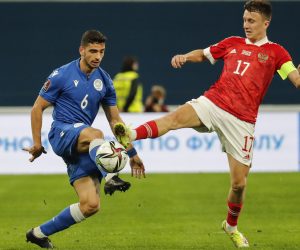epa09576689 Aleksandr Golovin (R) of Russia in action against Paris Psaltis (L) of Cyprus during the FIFA World Cup 2022 group H qualifying soccer match between Russia and Cyprus in St.Petersburg, Russia, 11 November 2021.  EPA/Anatoly Maltsev