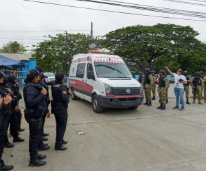 epa09580504 An ambulance exits the penitentiary of Guayaquil, Ecuador, 13 November 2021. A total of 58 inmates died and another 12 were injured in a new massacre registered in the Guayaquil penitentiary, located in southwestern Ecuador, the Governor of Guayas, Pablo Arosemena, reported. In a press conference, the Governor indicated that the confrontations took place in pavilion two, where there are an average of 700 prisoners.  EPA/Marcos Pin