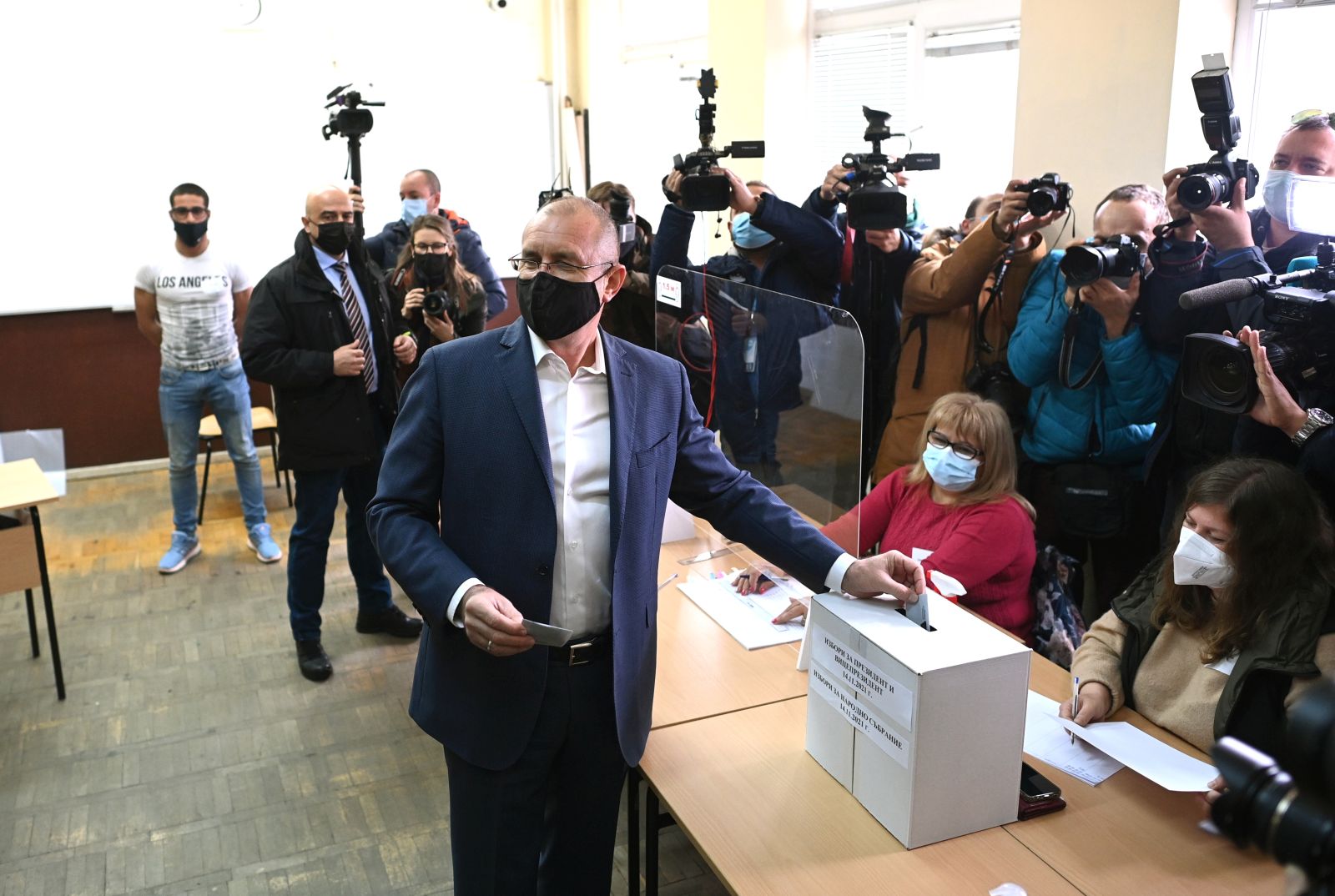 epa09581187 Bulgarian President Rumen Radev casts his ballot at a polling station during the general elections in Sofia, Bulgaria on 14 November 2021. Bulgarians are voting to elect a new parliament and a new president, amid a new wave of coronavirus, for the third time in 2021, hoping to end political deadlock  EPA/VASSIL DONEV