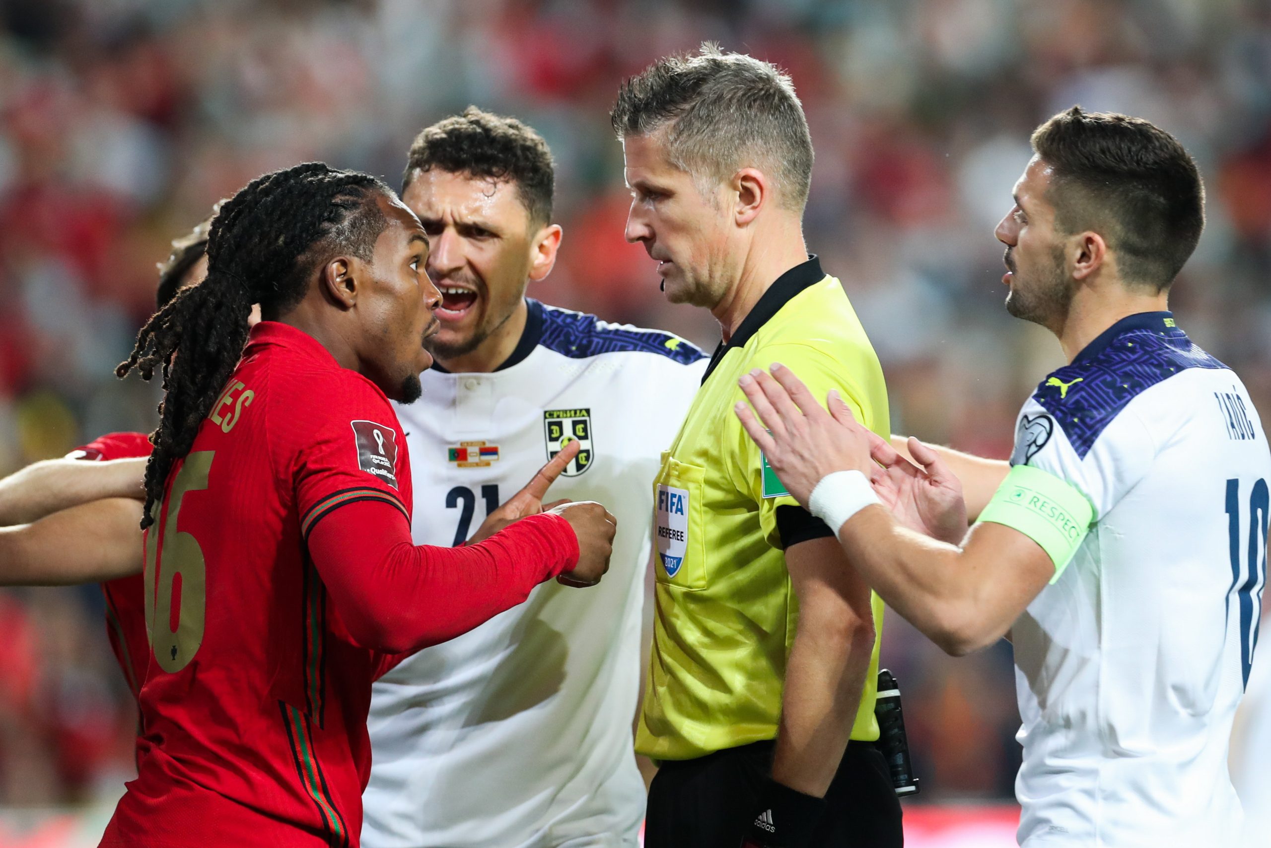 epa09582429 Portugal's player Renato Sanches (L) talks to the Italian referee Daniele Orsato (C) during the FIFA World Cup 2022 qualifying group A soccer match against Serbia at Luz Stadium in Lisbon, Portugal, 14 November 2021.  EPA/ANTONIO COTRIM