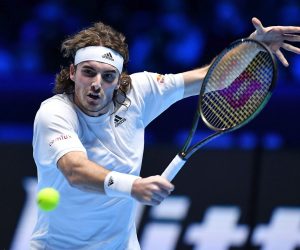 epa09584144 Stefanos Tsitsipas of Greece in action against Andrej Rublev of Russia during their group stage match of the Nitto ATP Finals tennis tournament in Turin, Italy, 15 November 2021.  EPA/Alessandro Di Marco