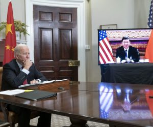 epa09584529 US President Joe Biden listens during a virtual summit with Chinese President Xi Jinping in the Roosevelt Room of the White House in Washington DC, USA, 15 November 2021.  EPA/SARAH SILBIGER / POOL