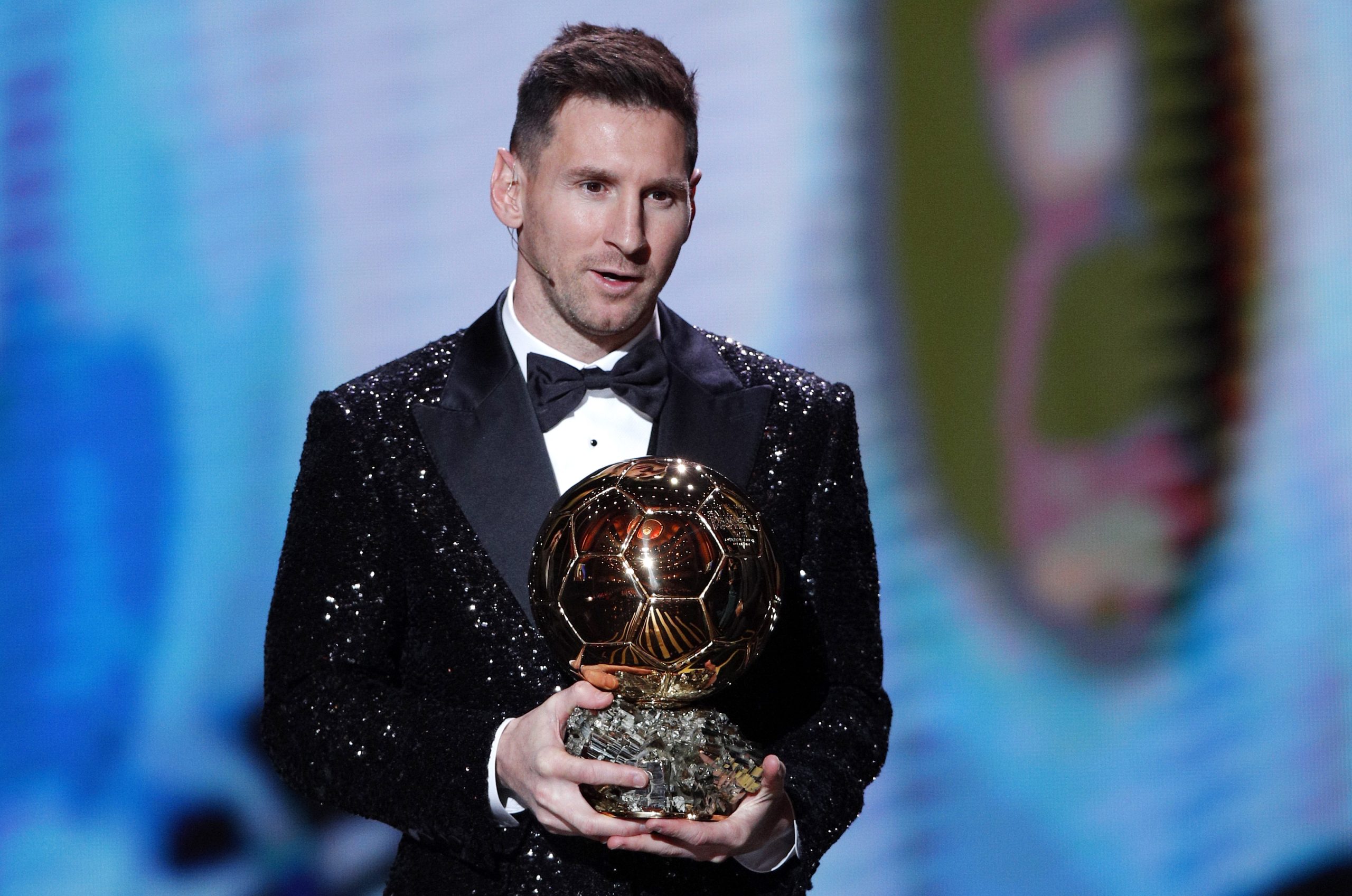 epa09611690 PSG player Lionel Messi wins the Men's Ballon d'Or at the 2021 Ballon d'Or ceremony at Theatre du Chatelet in Paris, France, 29 November 2021.  EPA/YOAN VALAT