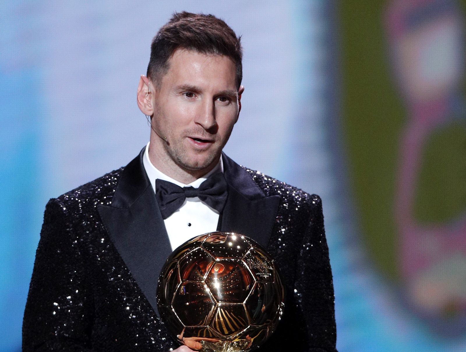 epa09611690 PSG player Lionel Messi wins the Men's Ballon d'Or at the 2021 Ballon d'Or ceremony at Theatre du Chatelet in Paris, France, 29 November 2021.  EPA/YOAN VALAT