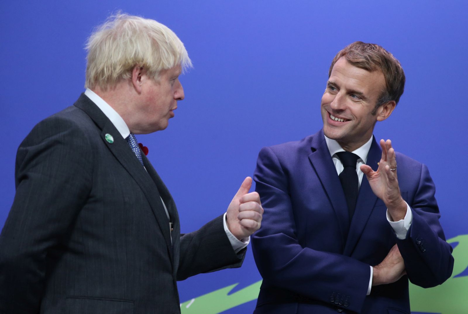 epa09557892 British Prime Minister Boris Johnson (L) greets French President Emmanuel Macron as leaders arrive for the COP26 UN Climate Summit in Glasgow, Britain 01 November 2021. The COP26 climate change conference runs from 31 October to 12 November 2021 in Glasgow.  EPA/ROBERT PERRY