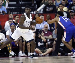 New Orleans Pelicans' Zion Williamson (1) looks to pass the ball during the team's NBA summer league basketball game against the New York Knicks on Friday, July 5, 2019, in Las Vegas. Knicks' Allonzo Trier is at right. (AP Photo/Steve Marcus)