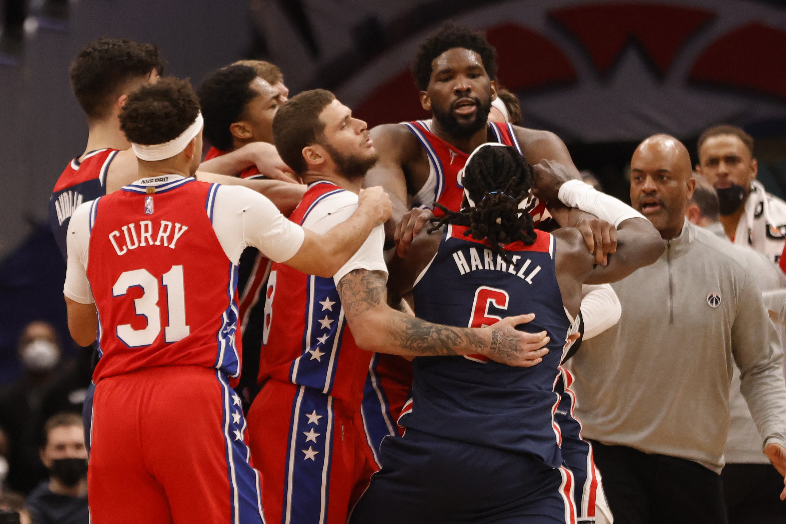 Dec 26, 2021; Washington, District of Columbia, USA; Philadelphia 76ers center Joel Embiid (21) and Washington Wizards center Montrezl Harrell (6) get into an altercation during the third quarter at Capital One Arena. Mandatory Credit: Geoff Burke-USA TODAY Sports