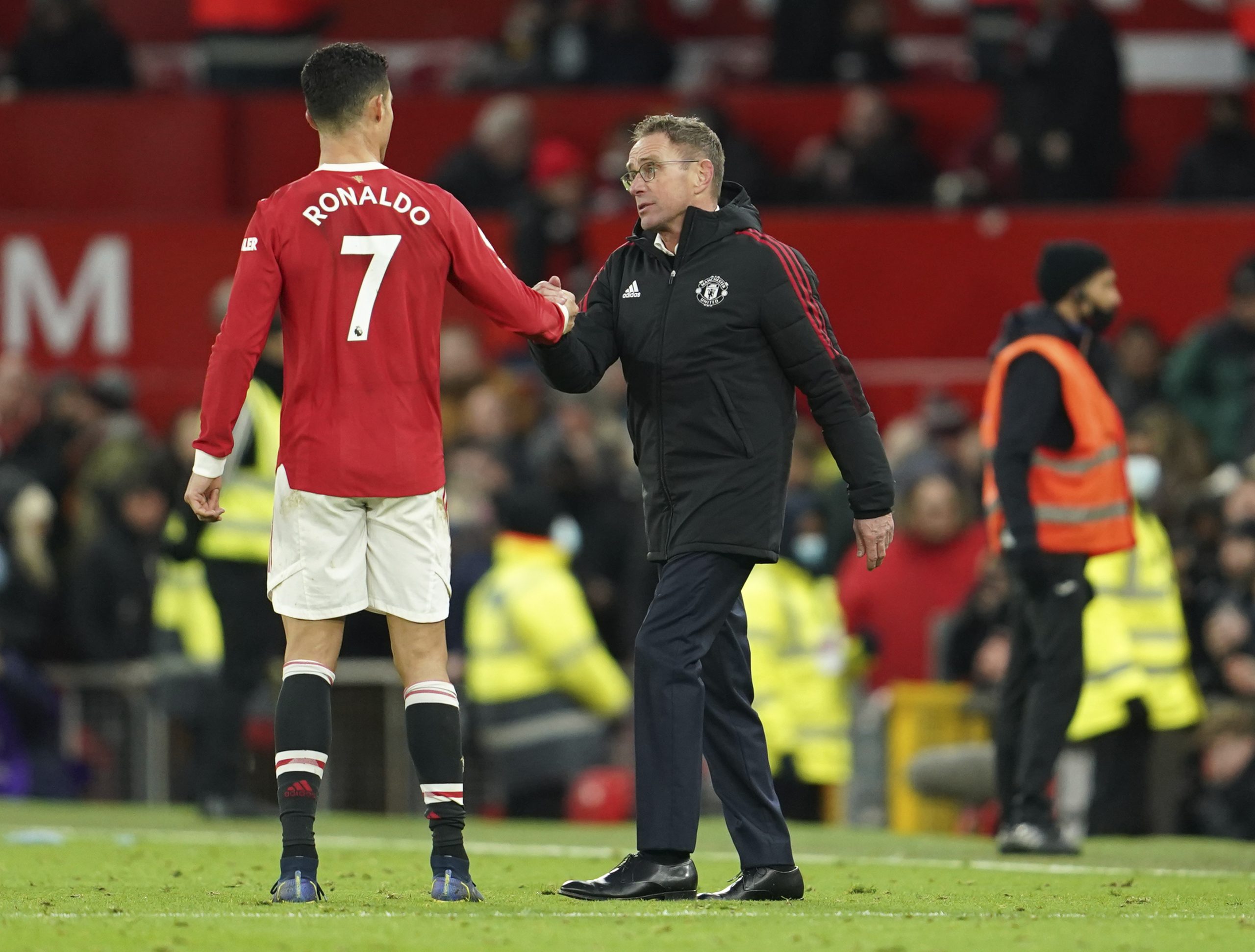 Manchester United's manager Ralf Rangnick shakes hands with Manchester United's Cristiano Ronaldo at the end of the English Premier League soccer match between Manchester United and Crystal Palace at Old Trafford stadium in Manchester, England, Sunday, Dec. 5, 2021. (AP Photo/Jon Super)