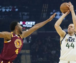 Utah Jazz's Bojan Bogdanovic (44) shoots over Cleveland Cavaliers' Evan Mobley (4) in the first half of an NBA basketball game, Sunday, Dec. 5, 2021, in Cleveland. (AP Photo/Tony Dejak)