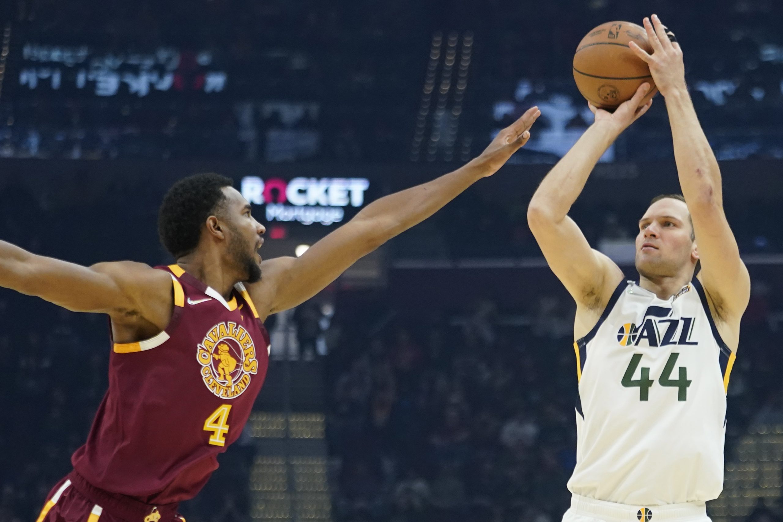 Utah Jazz's Bojan Bogdanovic (44) shoots over Cleveland Cavaliers' Evan Mobley (4) in the first half of an NBA basketball game, Sunday, Dec. 5, 2021, in Cleveland. (AP Photo/Tony Dejak)