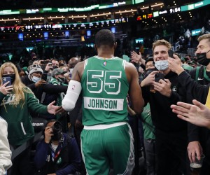 Boston Celtics' Joe Johnson is cheered by fans as he leaves the court after their win over the Cleveland Cavaliers in an NBA basketball game Wednesday, Dec. 22, 2021, in Boston. (AP Photo/Winslow Townson)