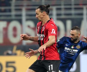 epa09570607 AC Milan’s Zlatan Ibrahimovic (L) challenges for the ball Inter Milan’s Marcelo Brozovic during the Italian Serie A soccer match between AC Milan and FC Inter at Giuseppe Meazza stadium in Milan, Italy, 07 November 2021.  EPA/MATTEO BAZZI