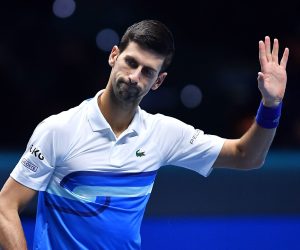 epa09592708 Novak Djokovic of Serbia in action against Cameron Norrie of Britain during their group stage match at the Nitto ATP Finals tennis tournament in Turin, Italy, 19 November 2021.  EPA/ALESSANDRO DI MARCO