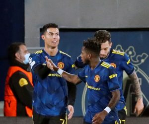 epa09599466 Manchester United's Cristiano Ronaldo (L) celebrates with his teammates after scoring the 0-1 goal during the UEFA Champions League group F between Villarreal CF and Manchester United at La Ceramica stadium in Vila-real, eastern Spain, 23 November 2021.  EPA/Biel Alino