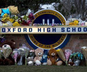epa09615619 A growing memorial is pictured outside Oxford High School a day after a 15-year-old student killed four classmates before surrendering to police at Oxford, High School in Oxford, Michigan, USA, 01 December 2021. The Oakland County Sheriff stated that in additional to the four killed, six other students and a teacher were wounded with a handgun investigators believe was purchased by the suspect's father a few days ago.  EPA/NIC ANTAYA