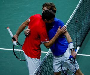 epa09624273 Andrey Rublev (R) of Russia is congratulated by Borna Gojo (L) of Croatia after winning their singles match during the Davis Cup Final between Russia and Croatia in Madrid, Spain, 05 December 2021.  EPA/Emilio Naranjo