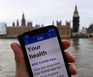 epa09641257 A Covid-19 pass is displayed on a mobile handset in London, Britain, 14 December 2021. Parliament in England is set to vote on the controversial Covid passports as Prime Minister Boris Johnson looks to push through his the new measures to counter the spread of the Omicron variant. Over seventy of Johnson's MP's are against the so called Covid passports, which could be mandatory for people to enter large events. The UK government has warned the public that the country is facing a 'tidal wave' of Omicron infections.  EPA/ANDY RAIN